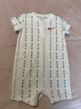 Nike White Infant One-Piece Romper with Red Swoosh